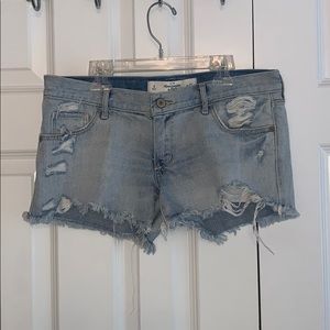 Regular rise light wash ripped jean shorts